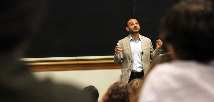 Distinguished author Mohsin Hamid gives a talk to Lehigh students in the Rauch Perella Auditorium on Wednesday, Sept. 9, 2015. His presentation explored themes of globalization through his work and life experiences. (Nadine Elsayed/B&W photo)