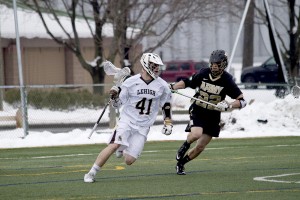 Senior attackman  Patrick Corbett looks for a shot against Army sophomore defenseman Reaves Klipstein on Saturday, March 21, 2015. The Mountain Hawks are currently 6-8. (Liz Cornell/B&W photo)