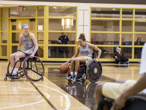 Sophomore guard and forward Kiernan McCloskey prepares for a pass while sophomore guard Kayla Burton dribbles the ball at the exhibition game in Grace Hall on Thursday, Apr. 9, 2015. The men's and women's teams played the Lehigh Valley Center for Independent Living Freewheelers in an exhibition game in celebration of the 25th anniversary of the passage of the Americans with Disabilities Act. (Chris Barry/B&W Photo)