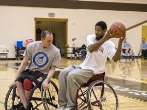 Sophomore guard Miles Simelton evades Chris Kile of the Lehigh Valley Center for Independent at the exhibition game in Grace Hall on Thursday, Apr. 9, 2015. The men's and women's teams played the Lehigh Valley Center for Independent Living Freewheelers in an exhibition game in celebration of the 25th anniversary of the passage of the Americans with Disabilities Act. (Chris Barry/B&W Photo)