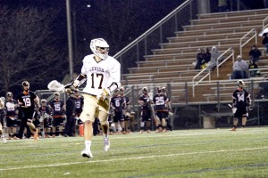 Junior attackman Reid Weber runs the ball downfield in the Mountain Hawks game against Princeton University on April 7, 2015 at Goodman Stadium. Weber had a hat-trick and helped Lehigh win 16-15. (Liz Cornell/B&W photo)