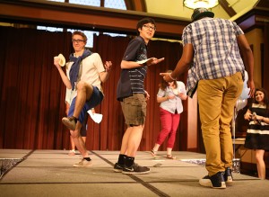 Kevin Jaramillo, '16, and Kenneth Wong, '16, play games on the stage during the fashion show at Lamberton Hall on Friday, April 17, 2015. Lehigh students created an art collective clothing line name "The Superiors." (Nan He/B&W photo)