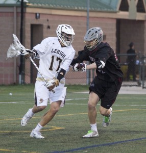 Junior attacker Reid Weber looks for an opening to score a goal against Lafayette at Banko Field on Friday, April 17, 2015. Weber scored four goals, including the winning goal, bringing the Mountain Hawks to a final score of 11-10 and allowing them a spot in their fifth straight Patriot League Tournament. (Liz Cornell/B&W photo)