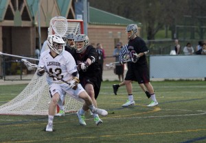 Senior attacker Patrick Corbett looks for an open shot on goal against Lafayette at Banko Field on Friday, April 17, 2015. The Mountain Hawks won with a final score of 11-10, allowing them a spot in their fifth straight Patriot League Tournament. (Liz Cornell/B&W photo)
