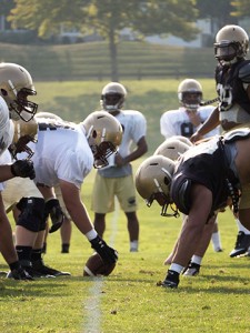 Football team members line up to practice plays on the football practice fields in Goodman Campus on Tuesday, Sept. 1 2015. The Mountain Hawks will face Central Conneticut State on Friday. (Chris Barry/B&W Photo)