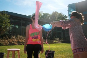 Aly Lang, '16, slimes Hayden Hosto, '18, at the Slime a Zeta event at the STEPS lawn on Tuesday, Sept. 15, 2015. The proceeds from Slime a Zeta go to the Zeta Tau Alpha Foundation to support breast cancer awareness and education. (Gaby Morera/B&W Photo)