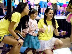 From left: Lizzie Litt, '18, Miracle Child Coco, and Alex Stephanou, '15 dance during the Morale Dance at Lehigh's second Dance Marathon on Saturday, Nov. 8, 2014. The Morale Dance was performed every hour, and each hour a new minute was taught to attendees. (Chris Barry/B&W Photo)