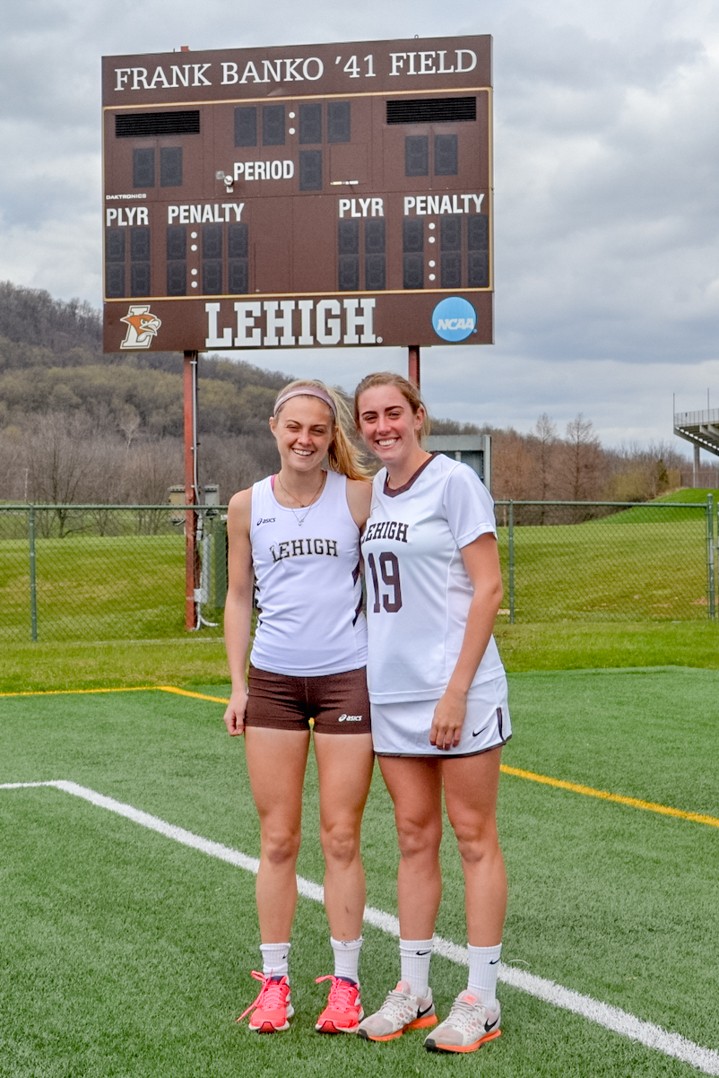 Twin sisters freshman distance runner Maura and midfield/defender Jane Henderson pose at Goodman Stadium on Friday, April 8, 2016. The twins are both members of Lehigh Sports teams, while Jane is a member of the Lacrosse team, Maura is a member of the Track and Field Team. (Kendall Coughlin/B&W Staff)