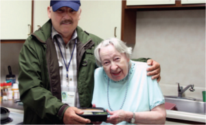 Dale Sourbeck works with one of the Meals on Wheels patrons. Sourbeck is in his fifth year volunteering for the program. (Courtesy of Meals on Wheels Northampton County)