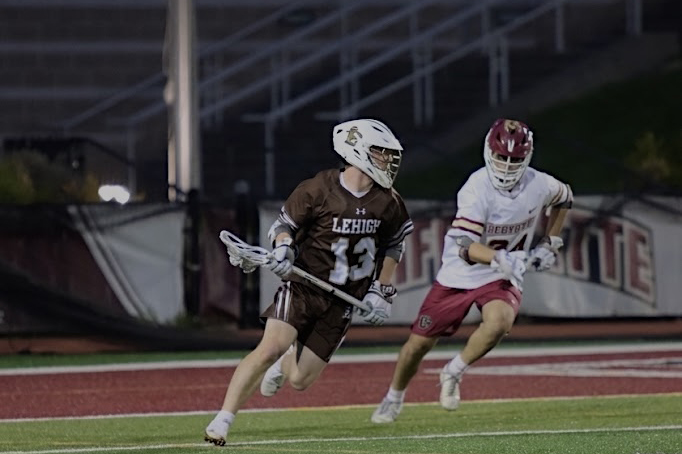 Lehigh men's lacrosse senior Andrew Kelly beats a Lafayette defender.