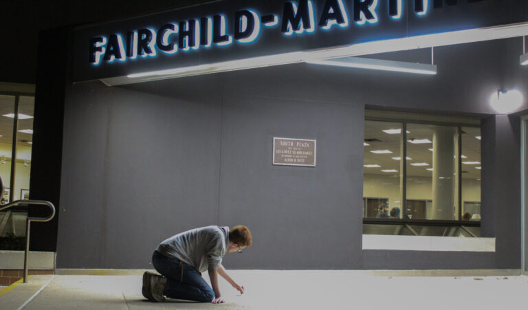Students for Life chalk outside FML, dissenters pour water
